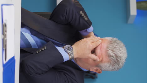 Vertical-video-of-Businessman-suffering-from-migraine.
